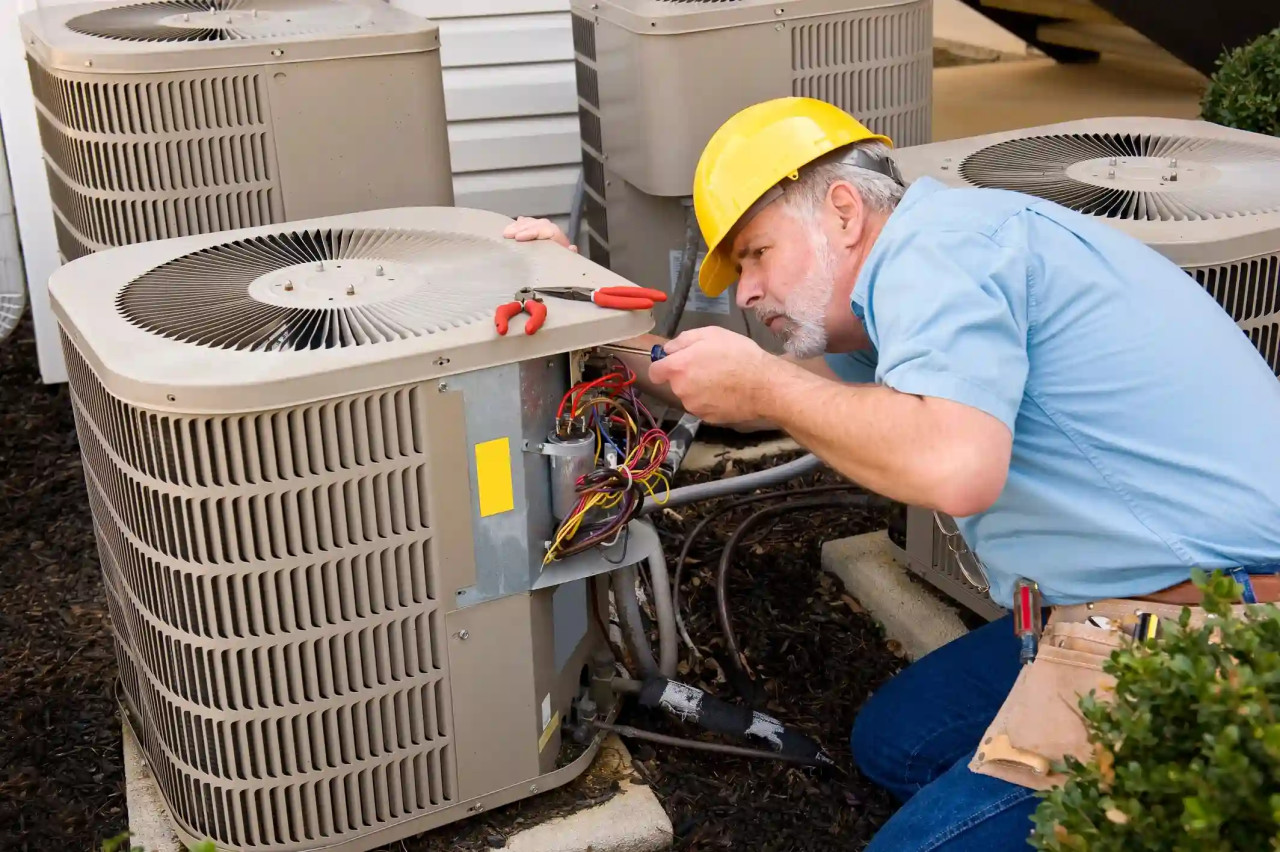 hvac-technician-repairing-outdoor-unit
