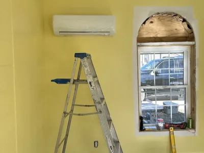 Residential mini-split AC system installation by Complete Refrigeration Services.