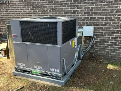 Large Carrier heating and cooling system installed outdoors for efficient climate control.