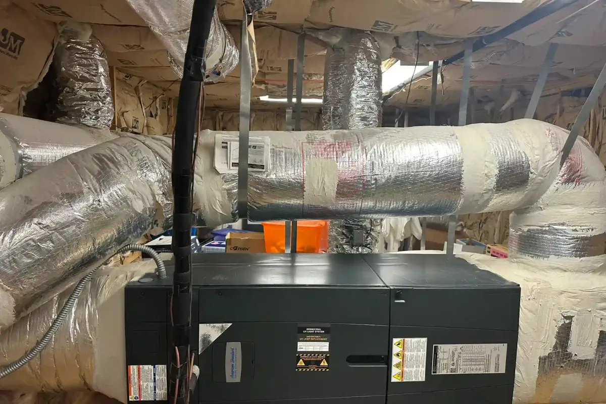 Central heating and cooling unit inspection by Complete Refrigeration Services.