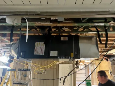 Central heating and cooling unit inspection by Complete Refrigeration Services.
