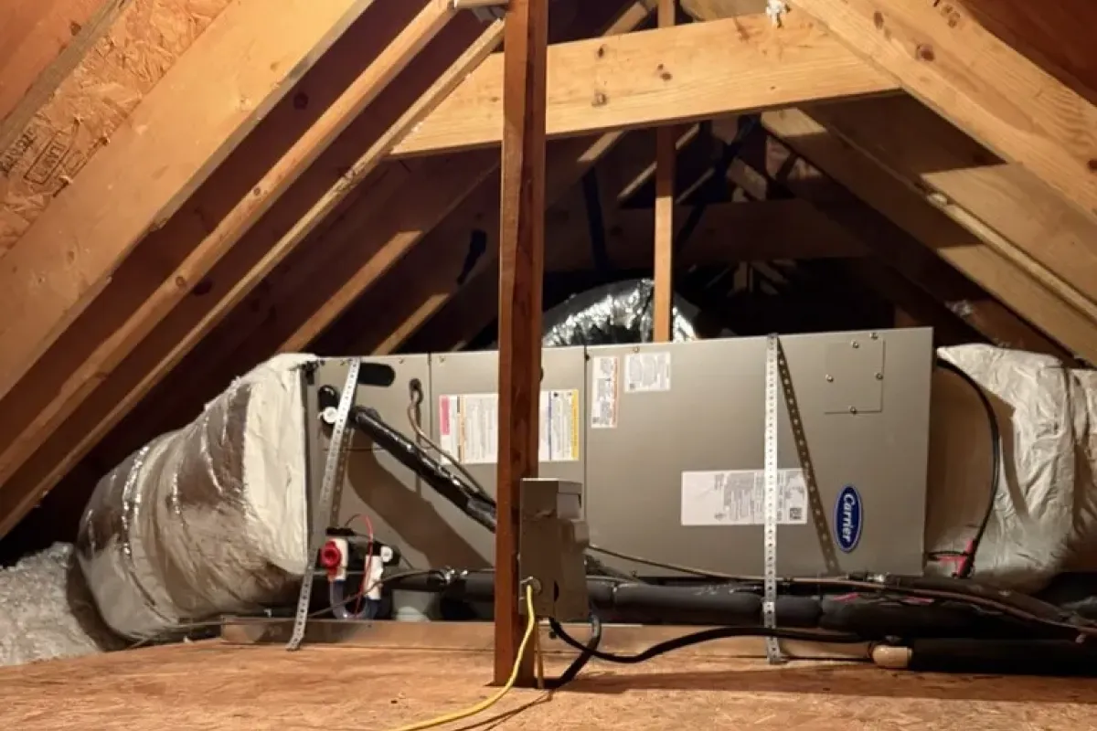 Carrier HVAC unit and ductwork installed in an attic by commercial cooling experts.